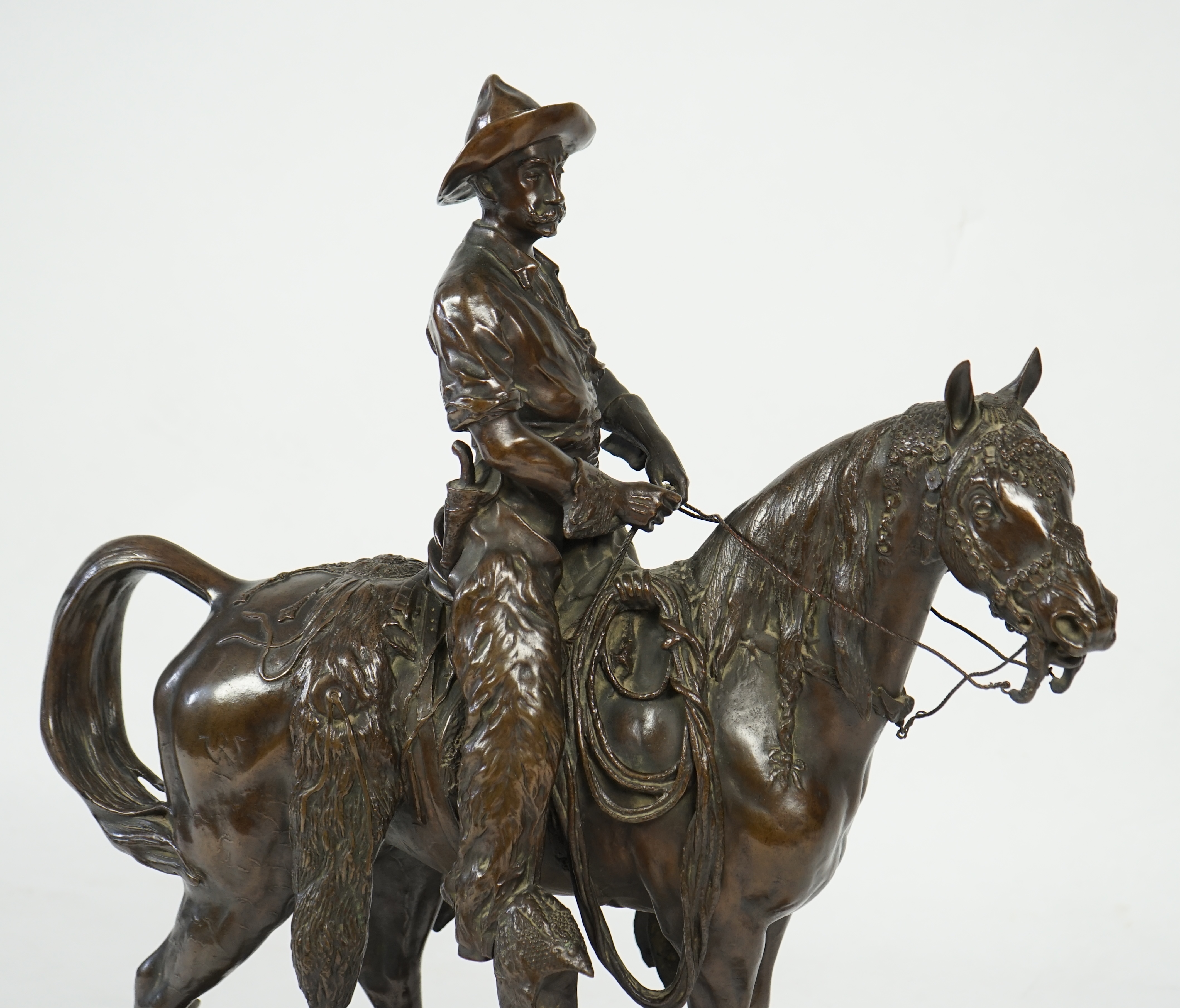 Walter Winans (St. Petersburg, 1852-Parsloe Park, Essex, 1920), a cast bronze of the artist, as a cowboy, riding the Arab stallion Skowronek, 50cm wide, 66cm high, overall 79.5cm high